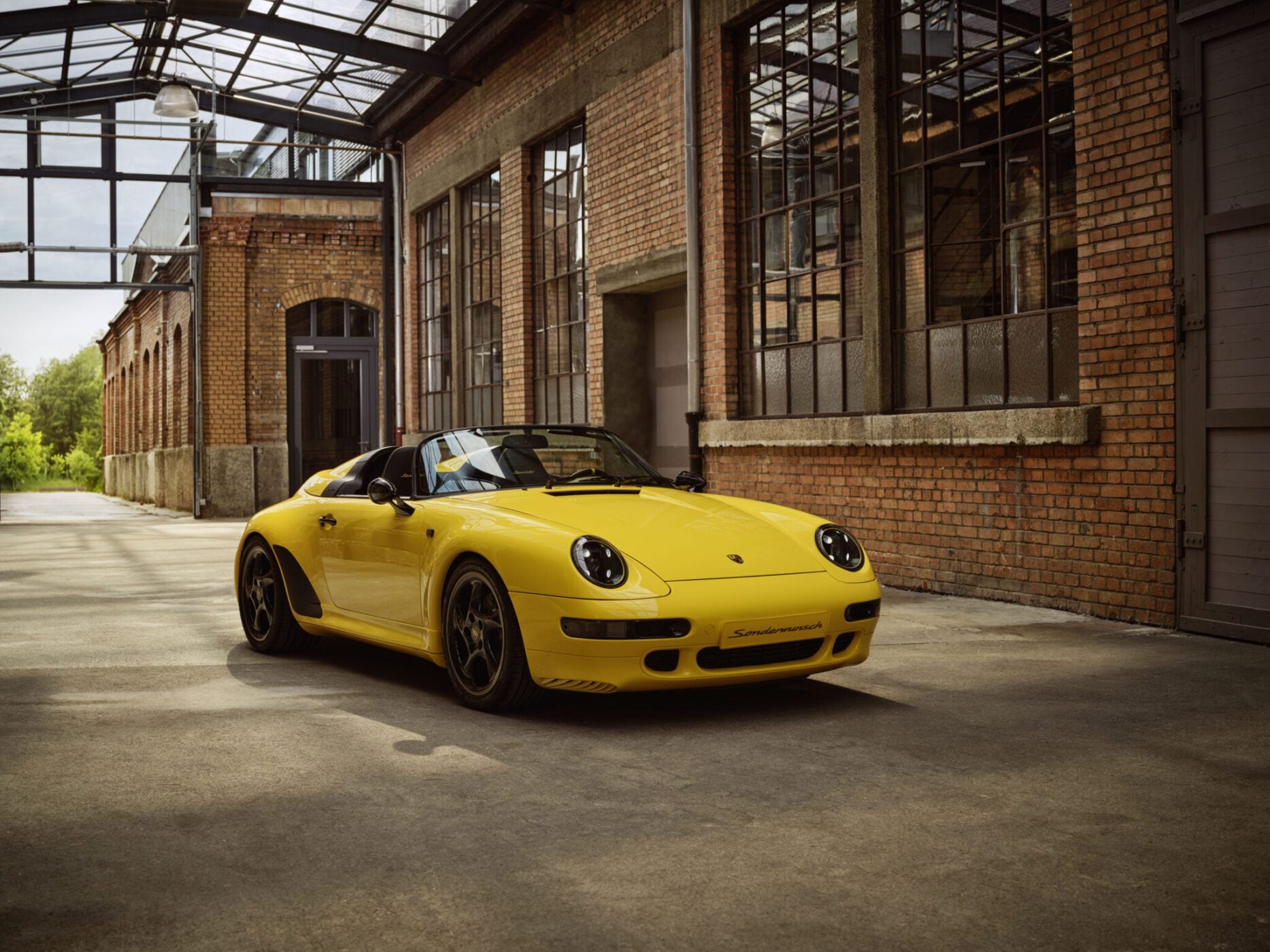 An image of a Porsche 911 Speedster in a warehouse.