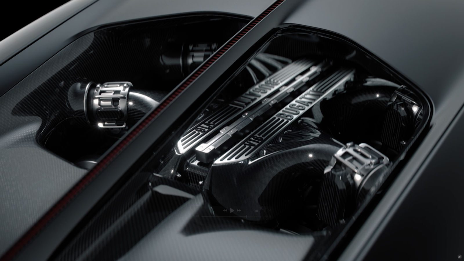 Close-up view of a Bugatti V16 engine under a clear cover, showcasing detailed mechanical components and carbon fiber surfaces—a stunning glimpse into cutting-edge automotive development.