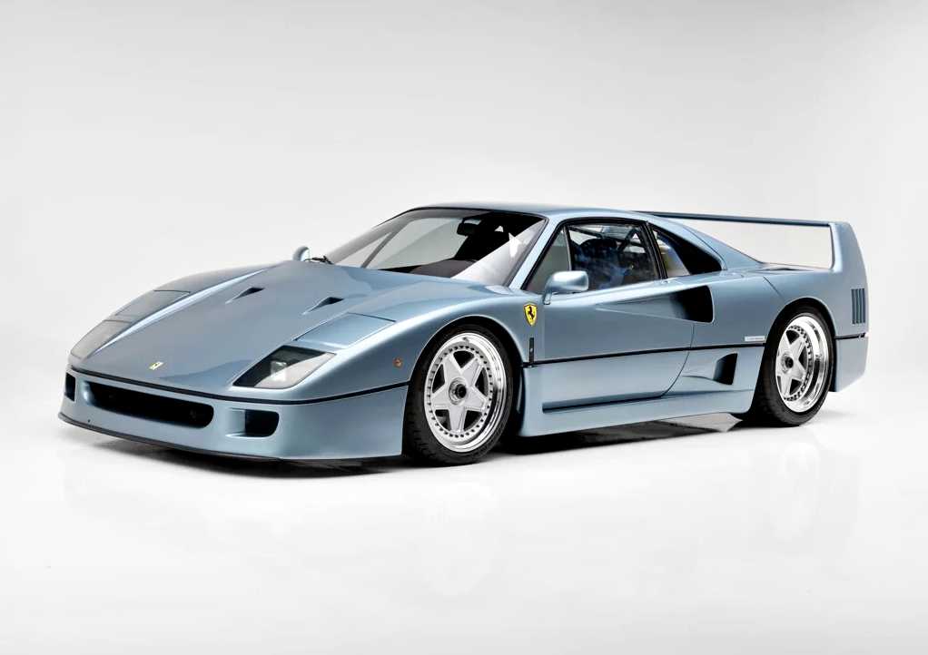 Azzurro Hyperion Ferrari F40 sports car photographed in a studio setting with a plain white background, showcased for RM Sotheby's.