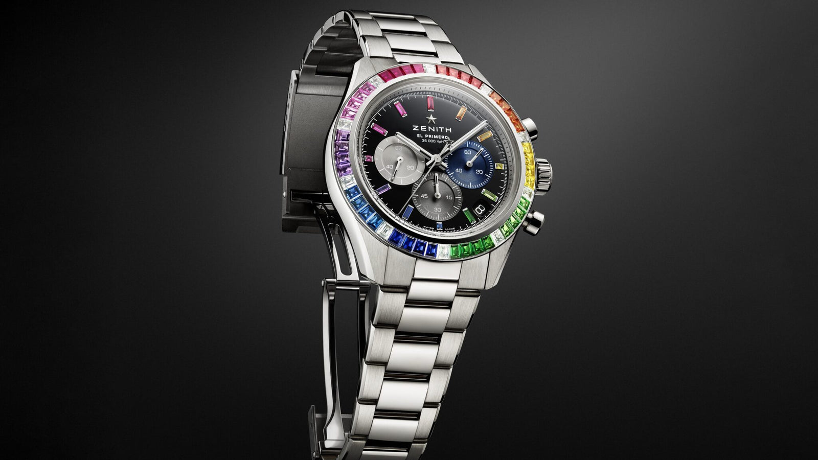 Experience the epitome of luxury with this Chronomaster Sport by Zenith, featuring a silver bracelet, black dial, and colorful gemstone-encrusted bezel on a gradient background. A standout piece inspired by LVMH Watch Week.
