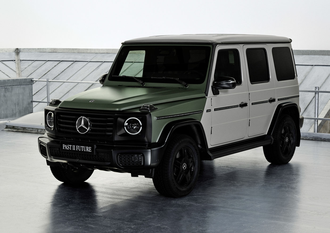 A Mercedes-Benz G-Class SUV, flaunting a stylish green and white two-tone paint job that evokes a Moncler-inspired elegance, is displayed indoors.