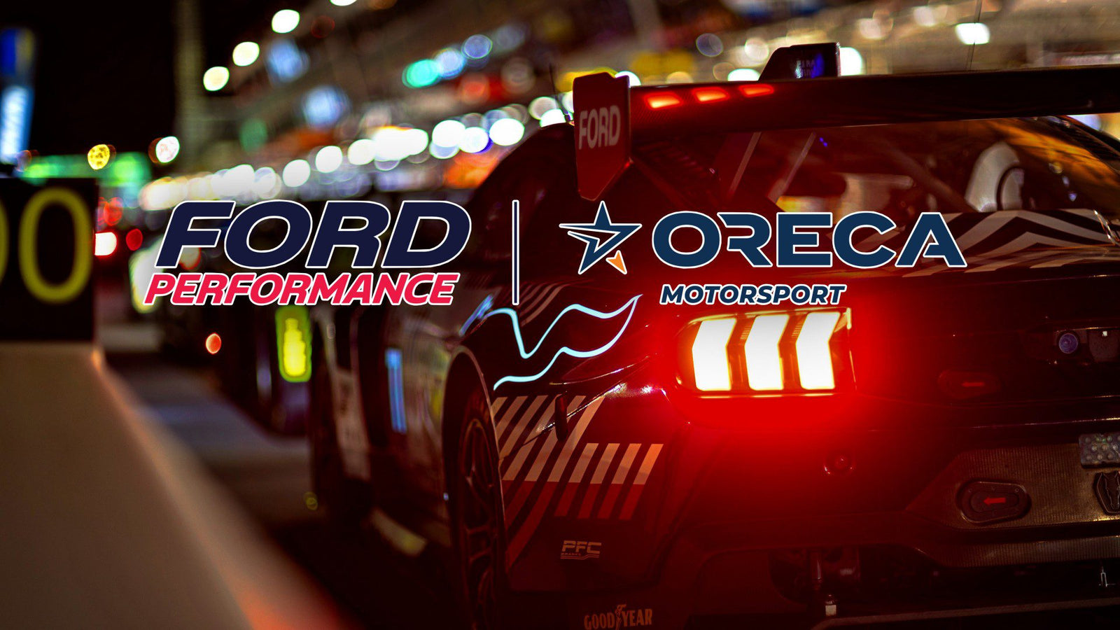 A race car with illuminated taillights is parked in a pit lane at night. The logos "Ford Performance" and "ORECA Motorsport" stand out, hinting at excitement for Ford returning to Le Mans and the anticipation of Ford Le Mans 2027.