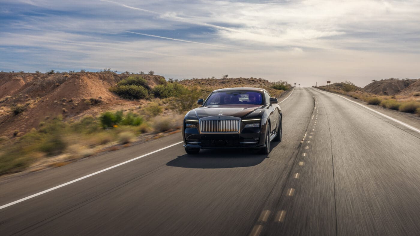 A Rolls-Royce Spectre on an open road.