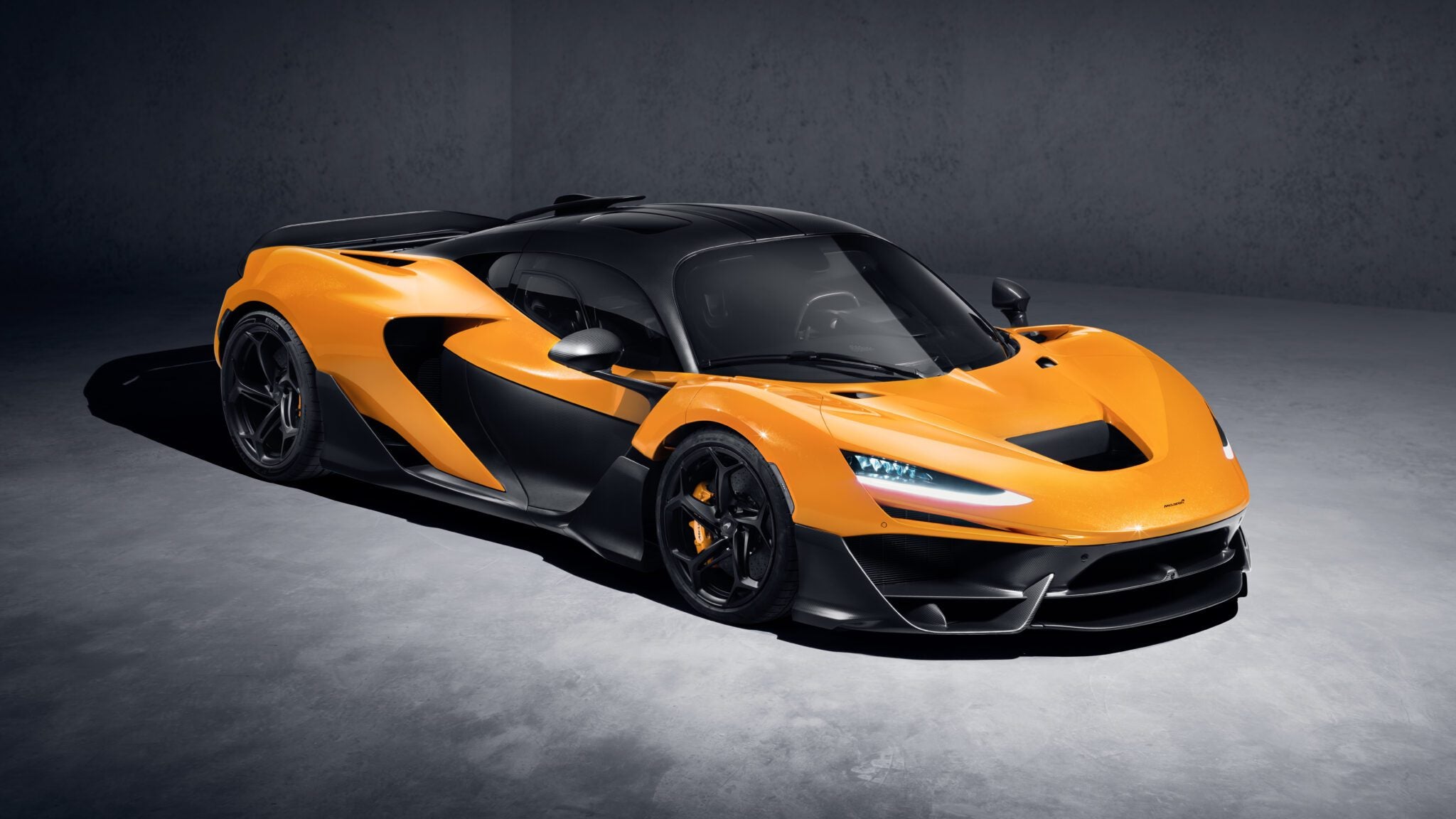A digital image of a McLaren W1 parked in a studio.