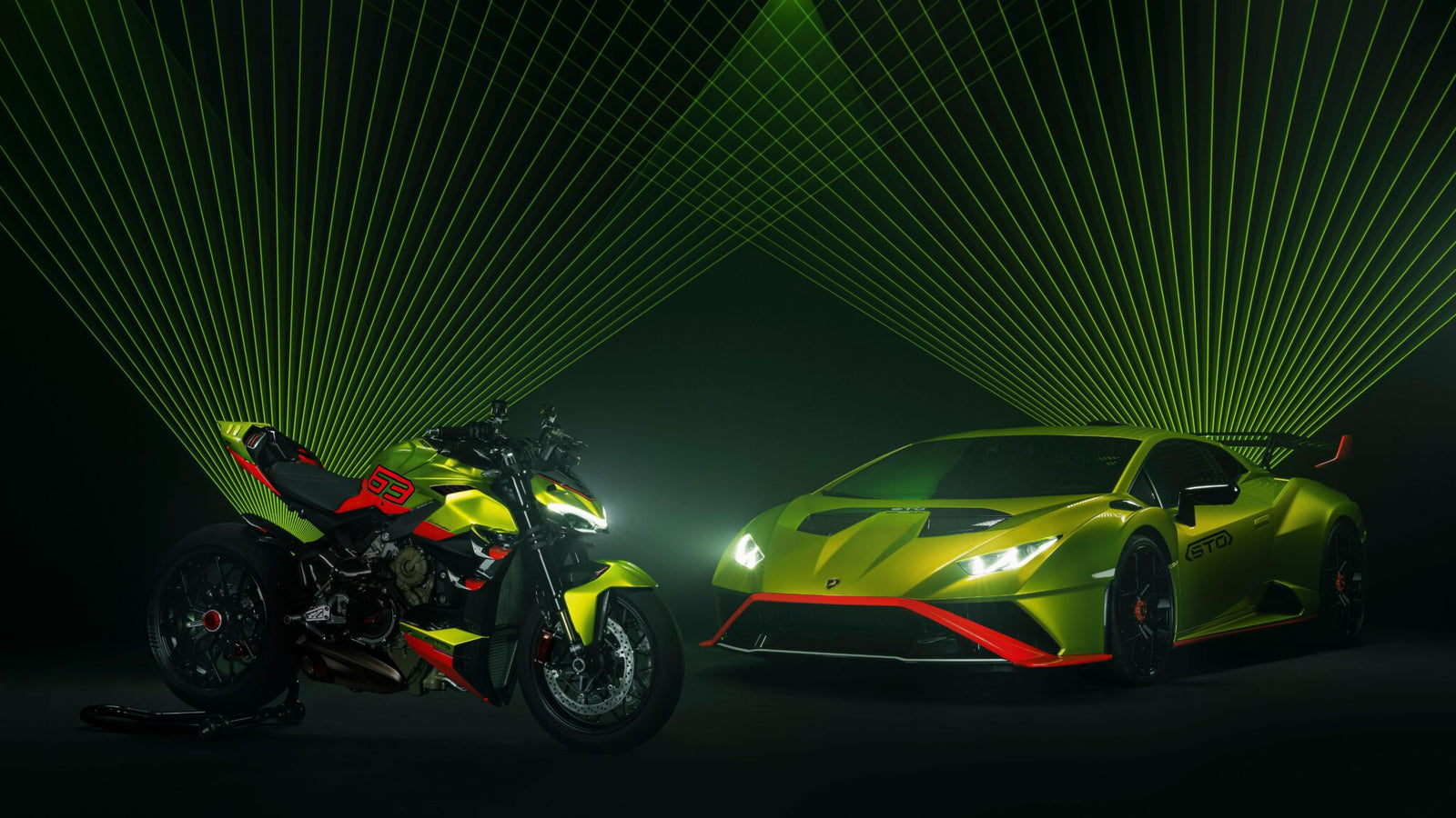 A neon green Lamborghini and Ducati motorcycle are parked side by side under green laser lights, creating a dynamic visual effect reminiscent of the vibrant displays at Milan Design Week.