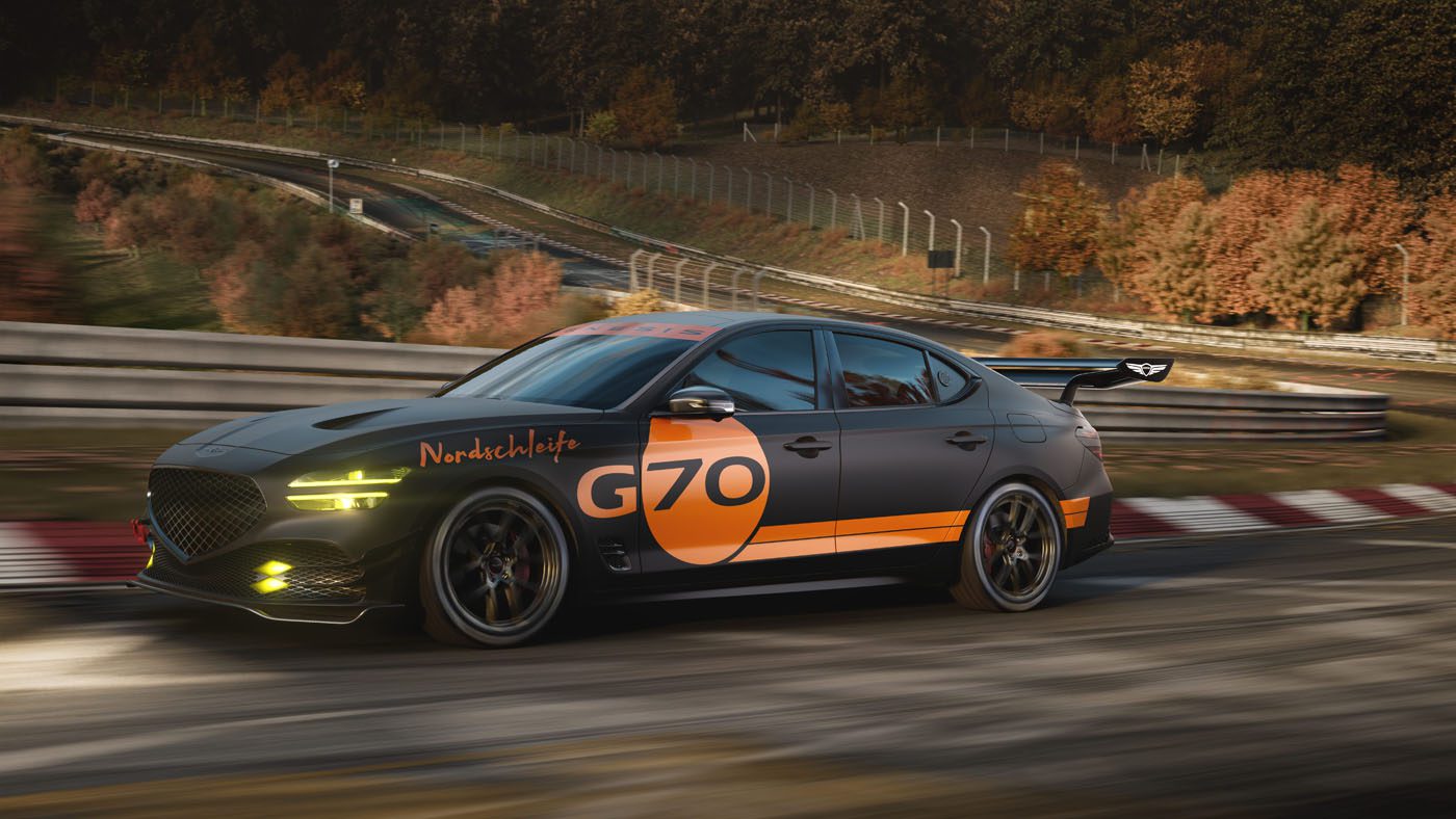 A black Genesis sports sedan with orange "G70" and "Nordschleife" decals races on a curvy track, embraced by autumn trees and metal guardrails—capturing the spirit of a G70 Track Day Special Concept.