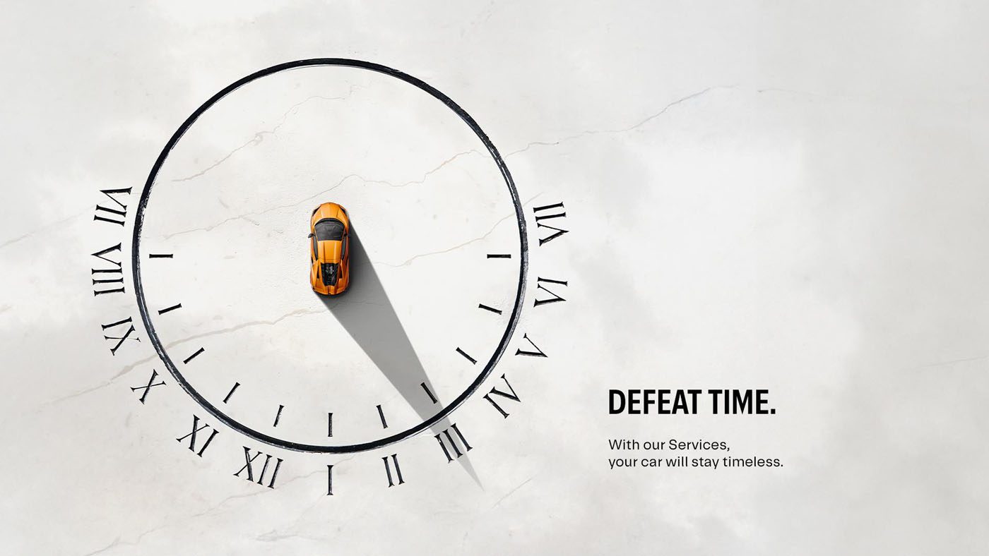 Top view of an orange Lamborghini at the center of a large clock face, its shadow stretching toward IV; text reads "Defeat Time. With our aftersales program, your car will stay timeless.