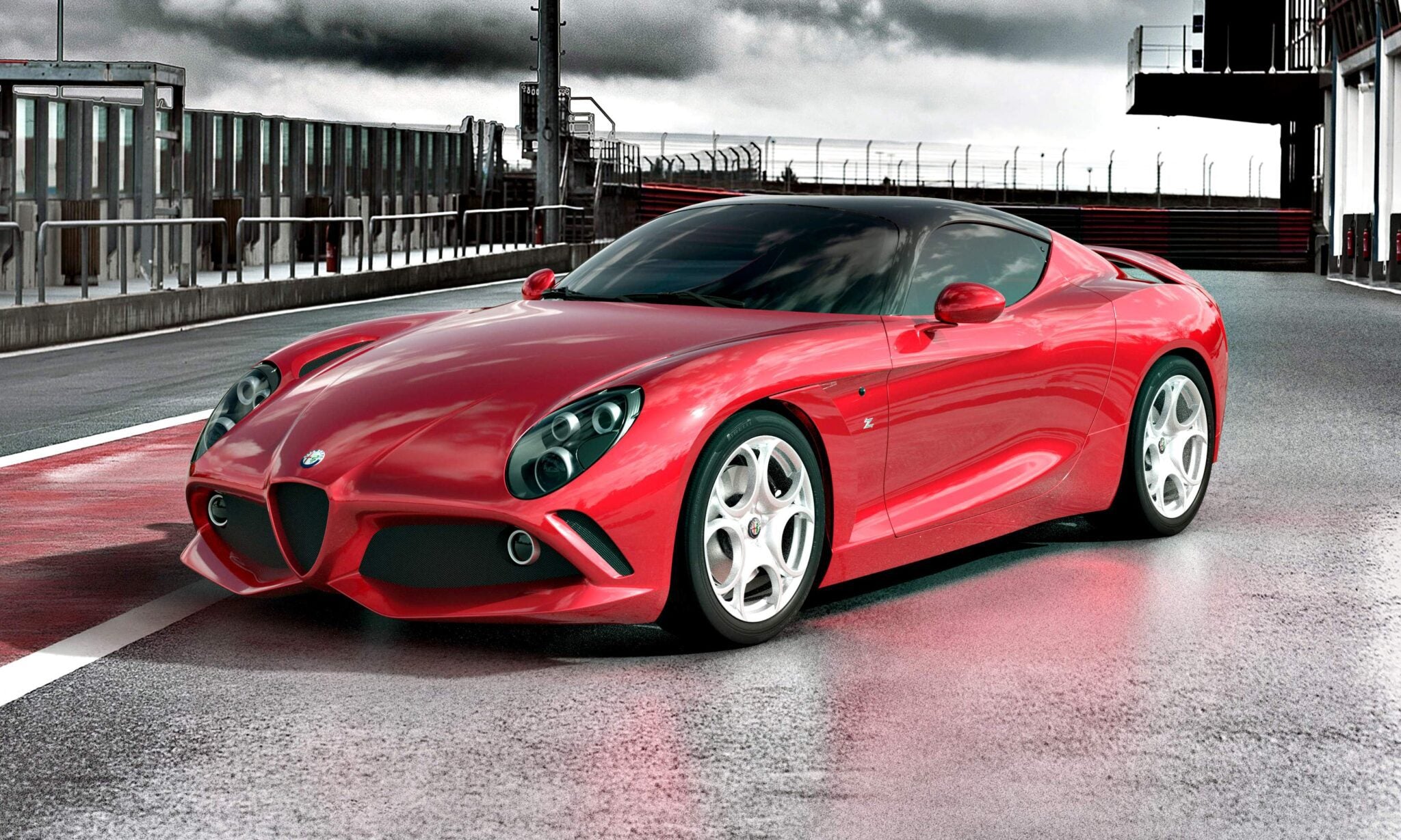 A shiny red sports car, the 1-of-1 Alfa Romeo DoppiaCoda by Zagato, is parked on a racetrack with a modern building and cloudy sky, highlighting the significance of this exclusive masterpiece.