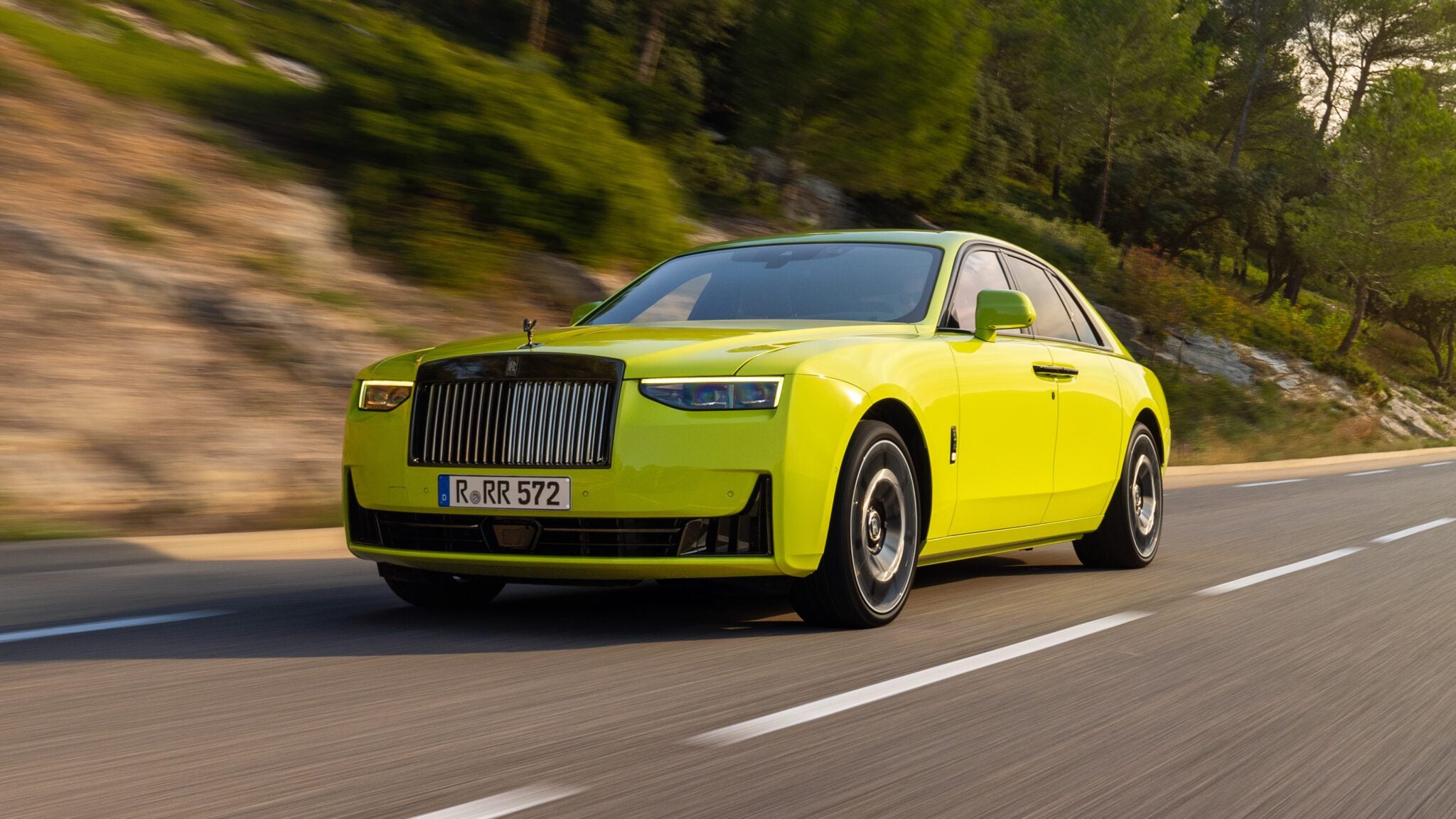 An image of a yellow Rolls-Royce Ghost Series II on the road.