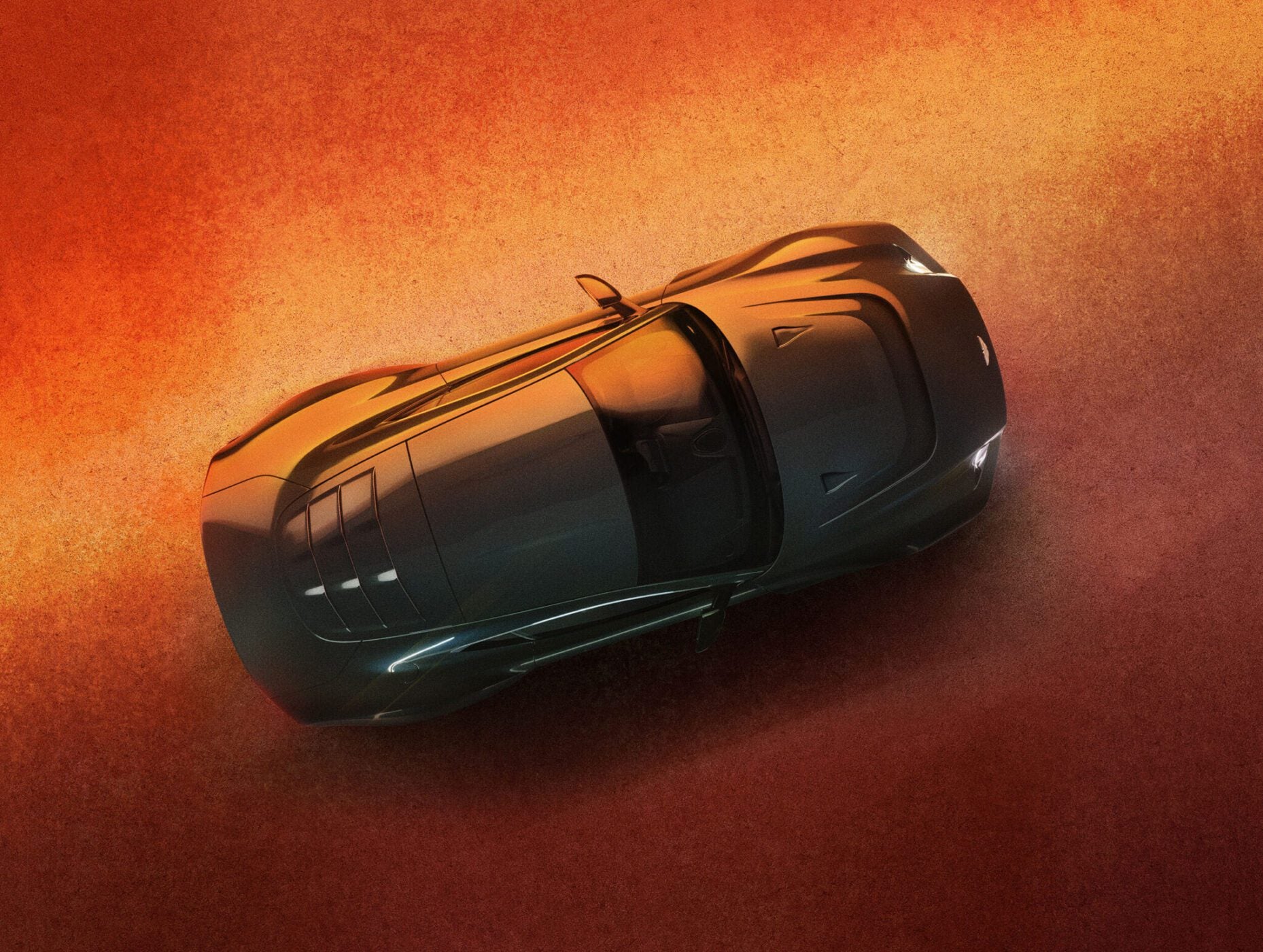A shiny, black sports car is viewed from above, parked on a textured, orange surface with subtle lighting highlighting its sleek design.