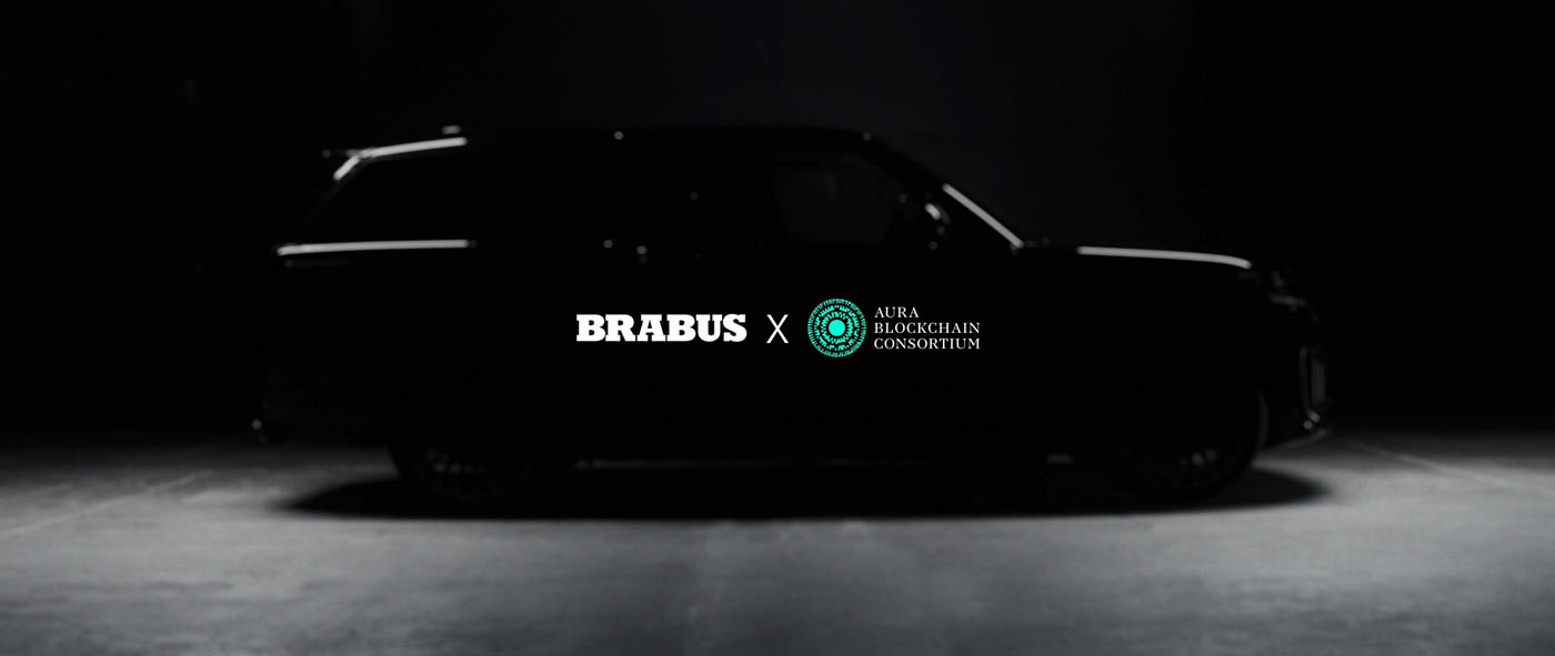 Silhouette of a black car with the logos "BRABUS" and "Aura Blockchain Consortium" on a dark background, embodying the essence of Masterpiece Supercars.