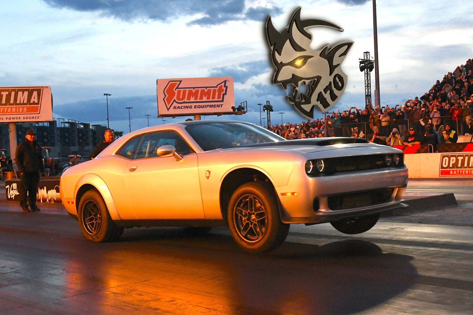 A silver 2023 Dodge Challenger SRT Demon 170 launches from a drag strip, front wheels lifted, with a crowd in the background and a Demon 170 logo above—a crown jewel no MOPAR collector can ignore. Dodge Demon 170 for sale.