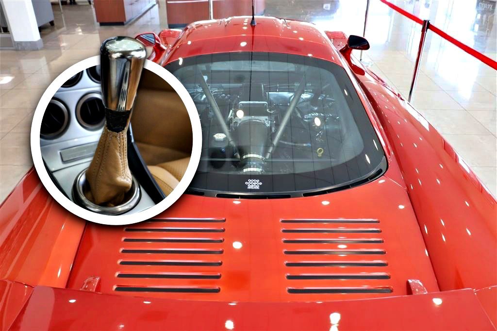 A red sports car with a visible rear engine under glass; inset shows a close-up of a manual gear shift lever inside the car—one of the best manual supercars for sale.