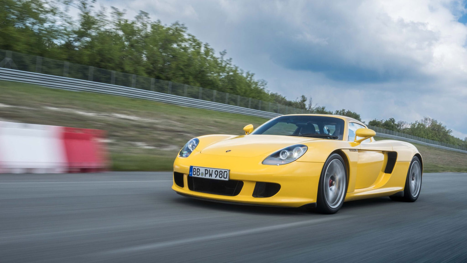 An image of a Porsche Carrera GT on a track.