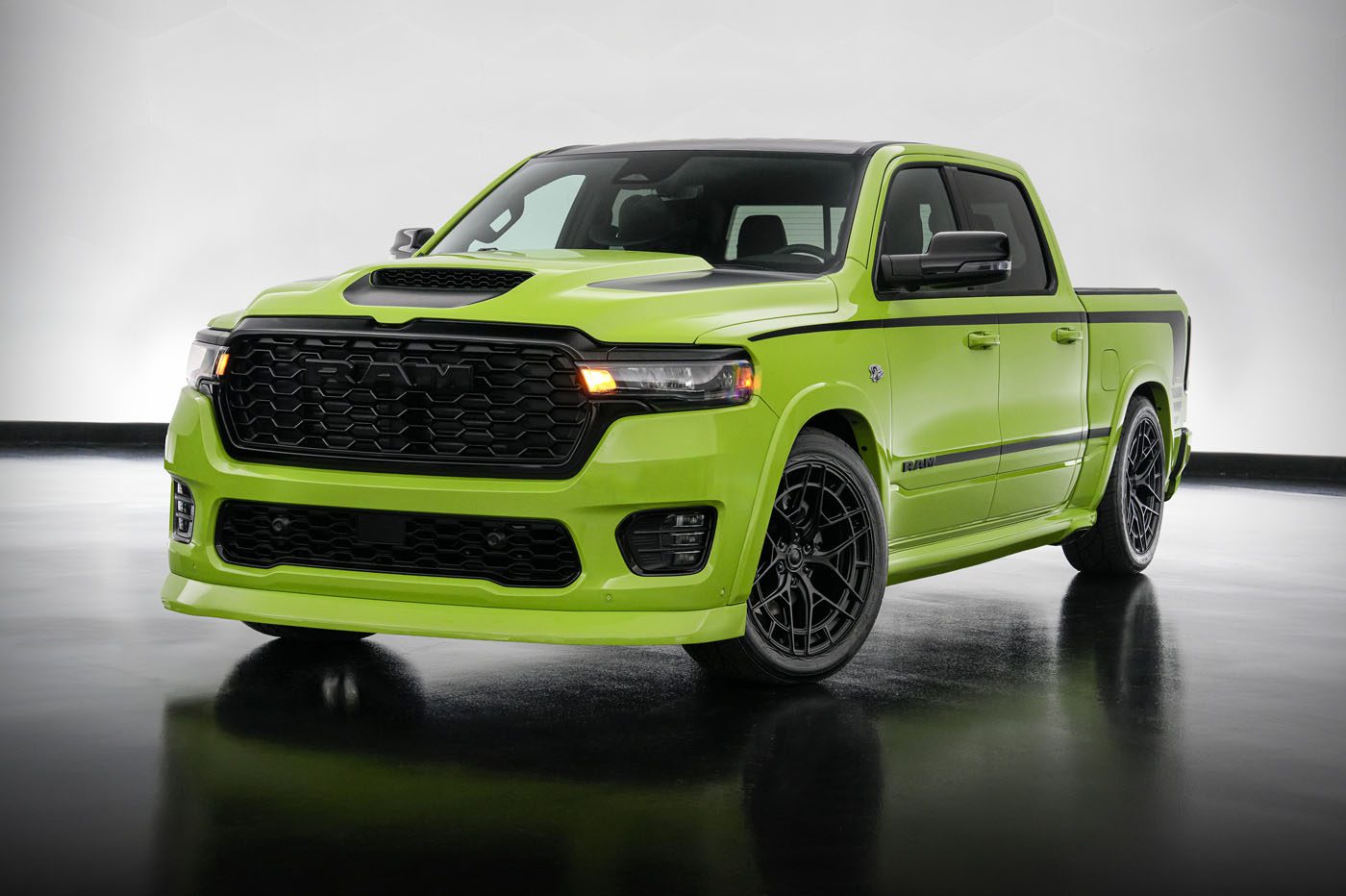 A bright green, modern pickup truck with black wheels and accents—showcasing Mopar Performance Concepts—is parked indoors on a reflective floor with a neutral background.
