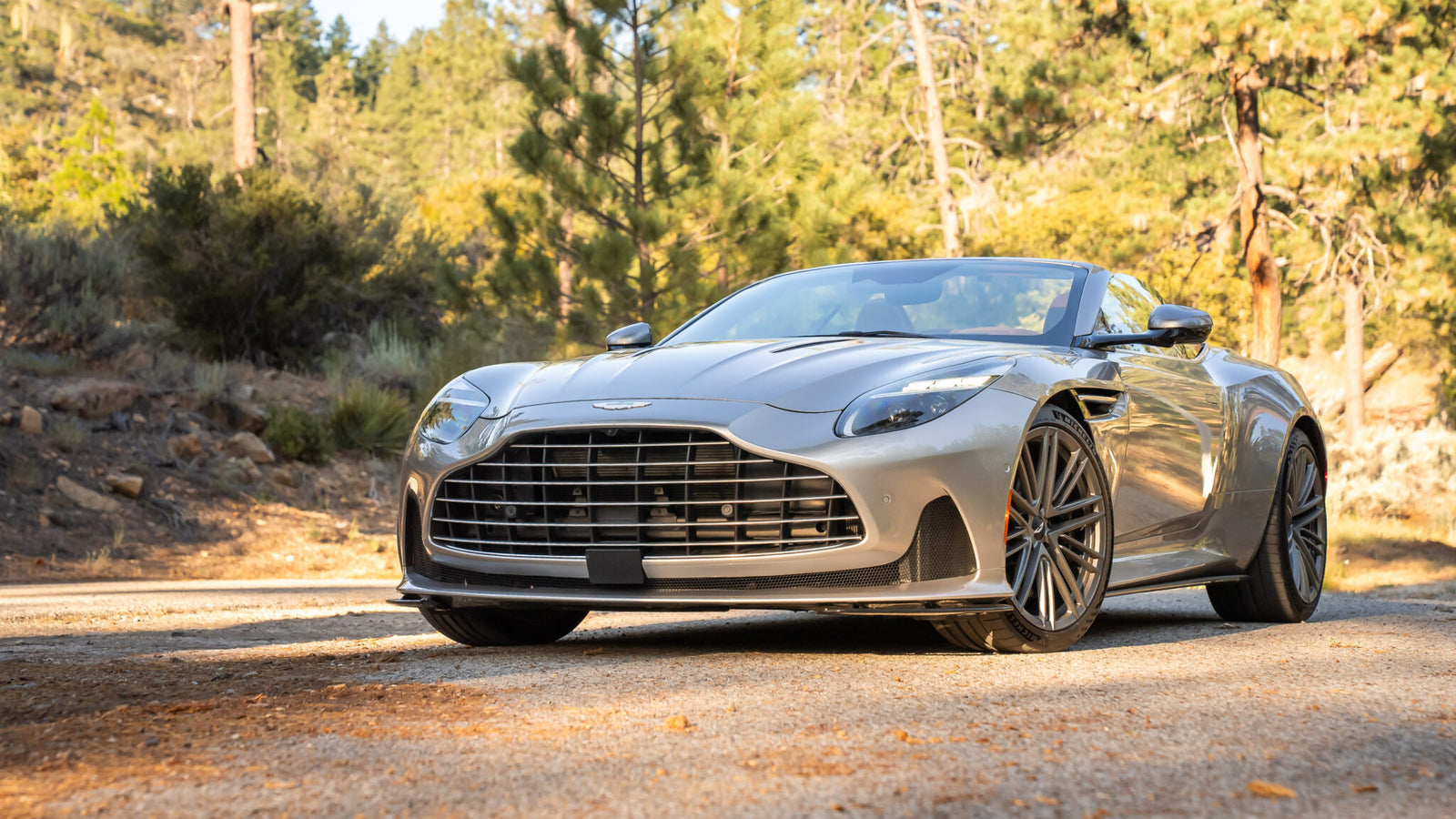 An image of an Aston Martin DB12 Volante parked outdoors.