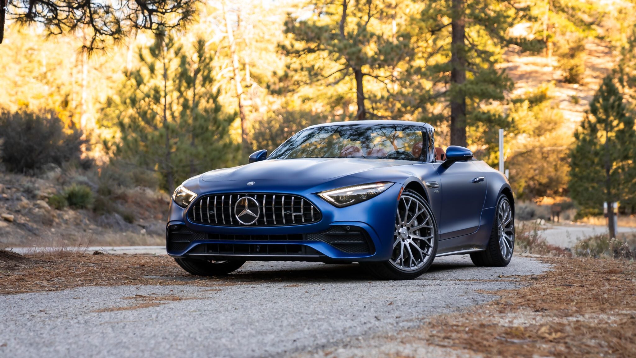 An image of a blue Mercedes-AMG parked outdoors.