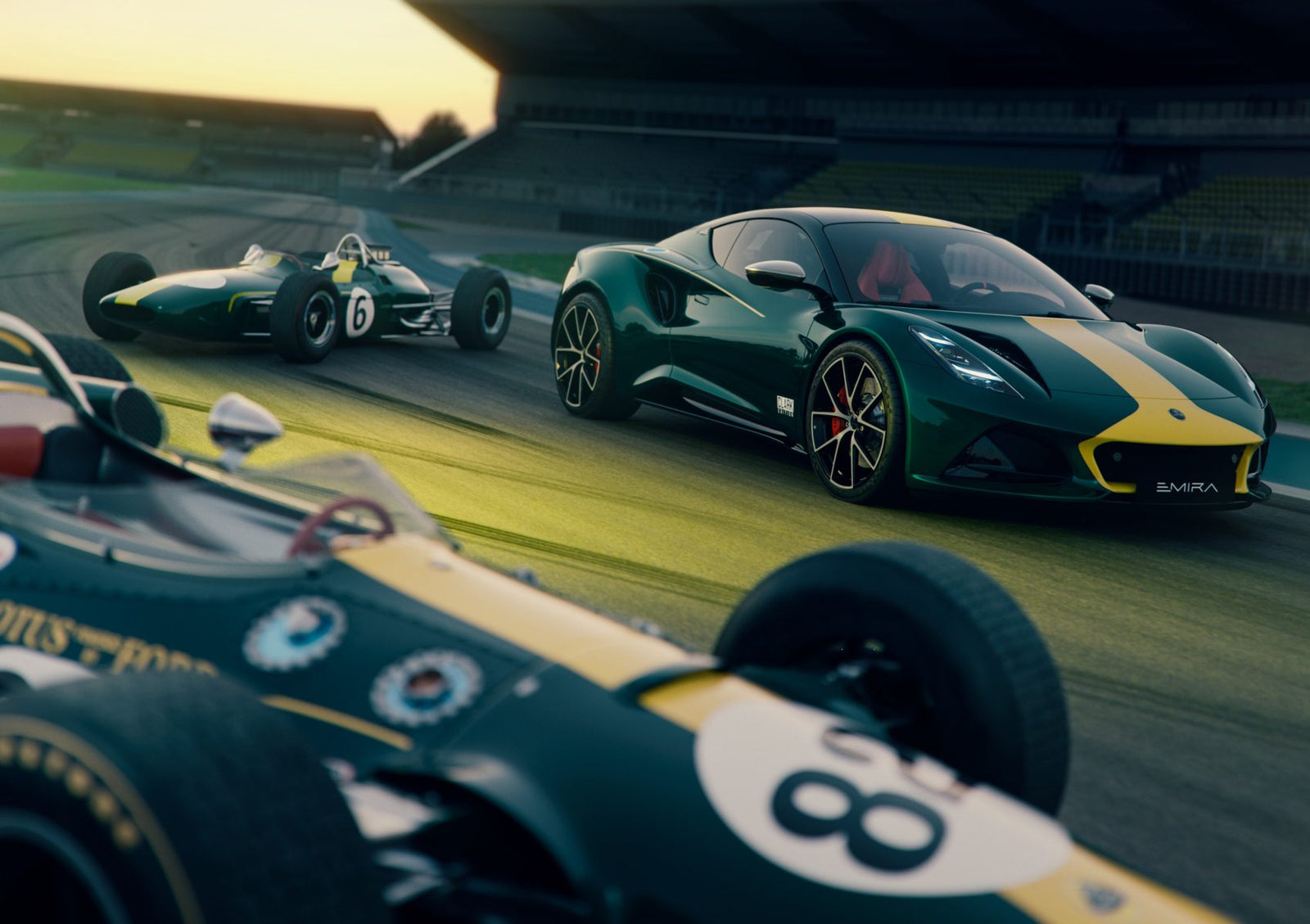 Three green and yellow Lotus race cars—F1 Legends from different eras—race at Goodwood, with a modern sports car leading two vintage Formula 1 machines once driven by icons like Senna.
