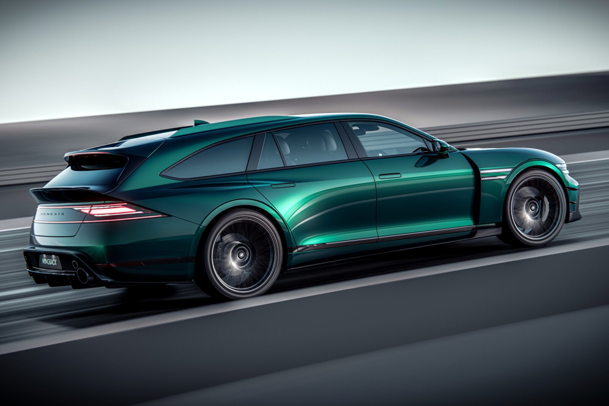 A sleek, green Wingback Wagon drives on a smooth, multi-lane road, viewed from the rear side, showcasing its aerodynamic design and tinted windows.
