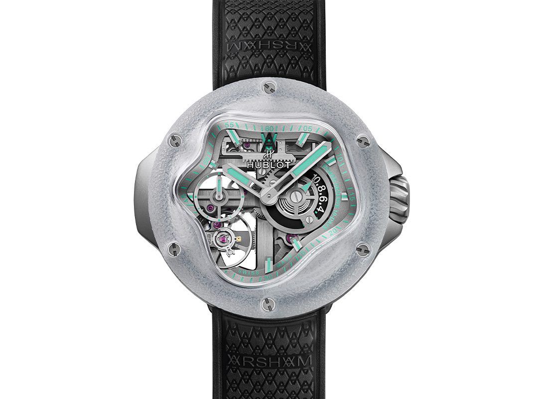 A modern wristwatch inspired by the Hublot MP-17, featuring a transparent, asymmetrical face revealing internal gears, a black textured strap, and mint green accents on the dial and hour markers—a striking limited edition piece.