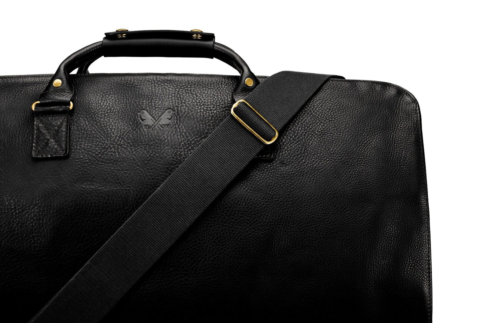 A close-up of a black leather bag with a textured surface, gold hardware, a shoulder strap, and a subtle embossed logo—perfect for those looking to upgrade your style with luxury accessories.