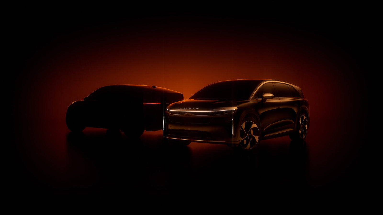 Two Lucid electric vehicles are outlined against a dark orange background, partially illuminated to reveal their sleek, modern designs with minimal visible details.