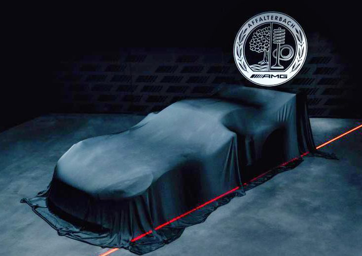 A car covered with a dark cloth sits beneath an illuminated AMG Affalterbach logo, hinting at the V8 Power and a Giant Wing: Mercedes Concept AMG GT Track Sport breaks cover, its form partially outlined by red lighting on a dark stage.