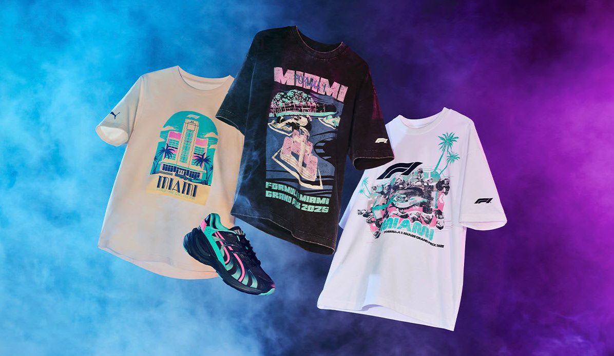 Three Miami Grand Prix Collection graphic T-shirts and PUMA Motorsport black sneakers with colorful accents are displayed against a blue and purple smoky background, capturing the spirit of Formula 1 in Miami.