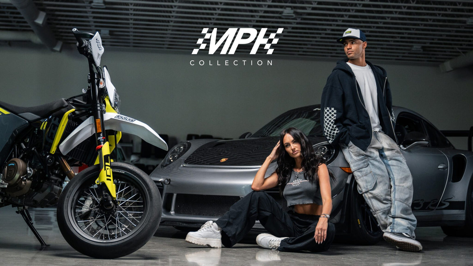Two people pose with a motorcycle and car, showcasing the Automotive-Inspired design under the "MPH Collection" logo in a showroom.