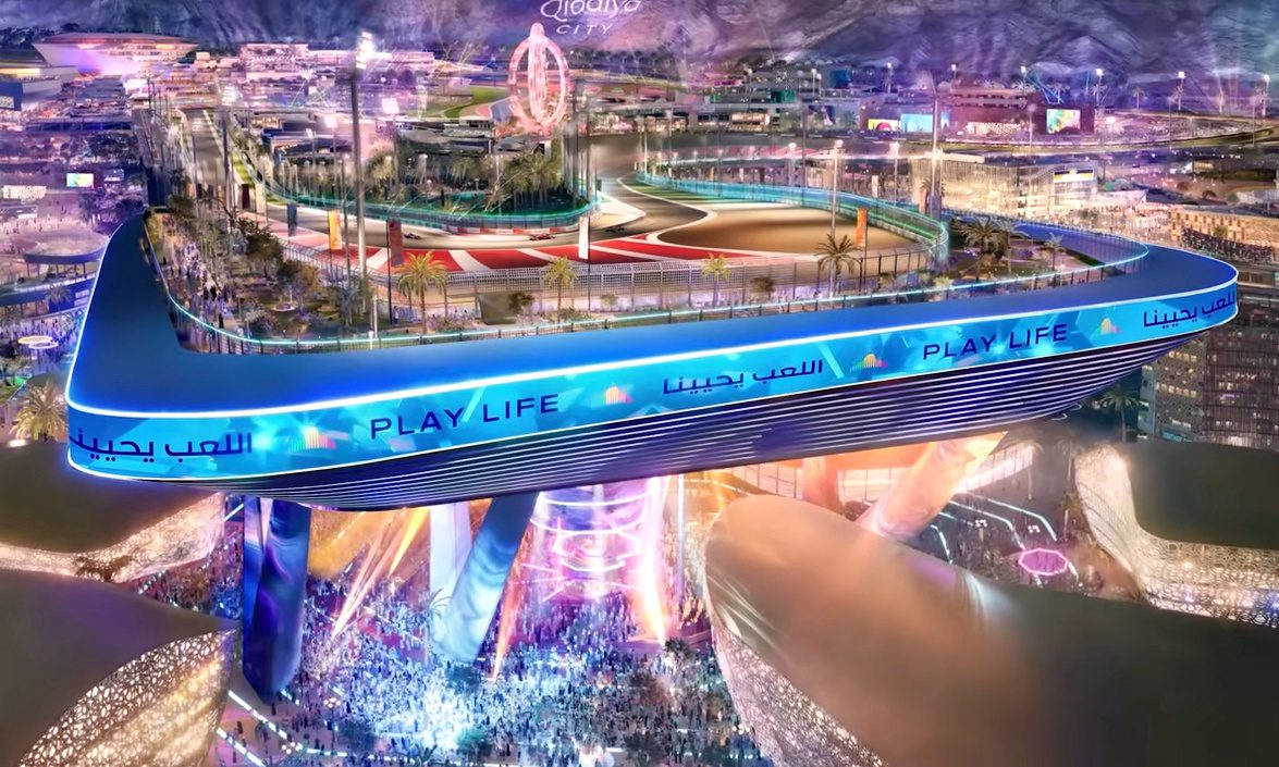 A large elevated race track labeled "PLAY LIFE" overlooks a brightly lit cityscape, with crowds gathered below and colorful lights illuminating the area—this upcoming F1 track’s opening corner is 20 storeys up in the sky.