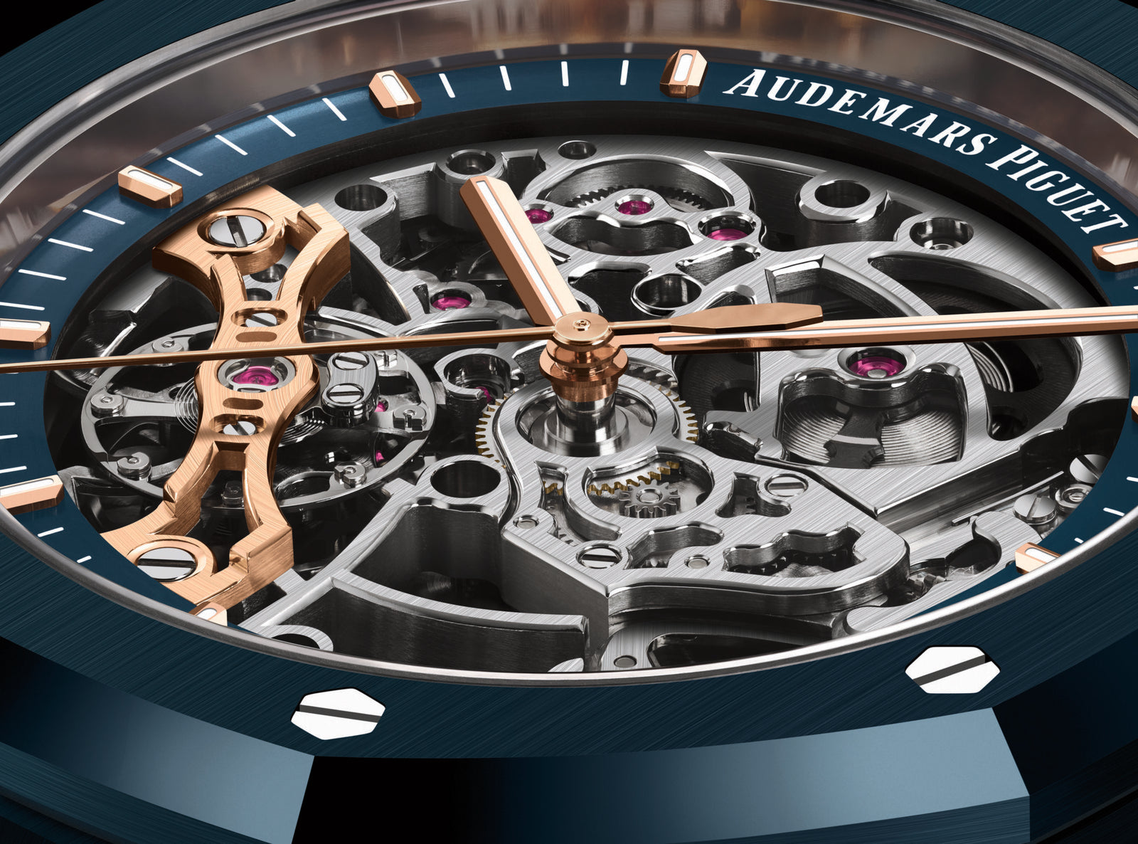 Close-up of an Audemars Piguet watch face showcasing horological highlights—visible intricate gears, rose gold details, and a blue outer ring with screws—making it a standout among the most expensive watches.