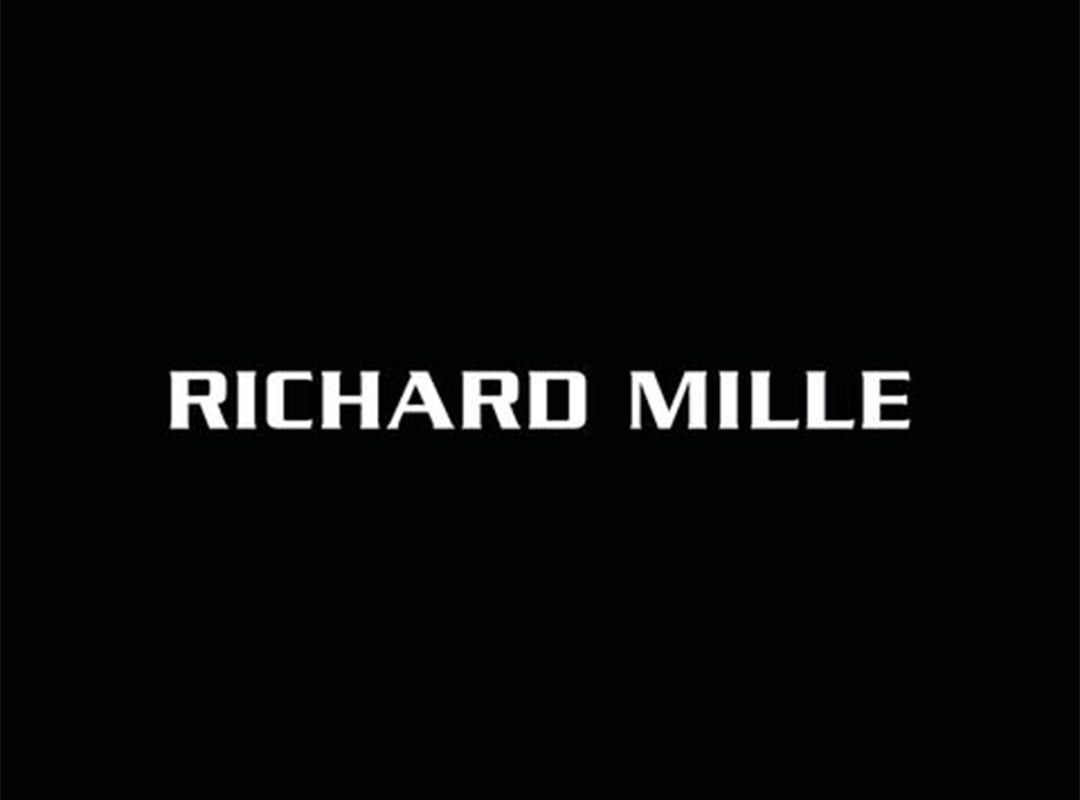 Text displaying "RICHARD MILLE" in white capital letters on a black background, reminiscent of the precision and elegance found in a Brough Superior or the sophisticated allure of an RMB 01 watch.