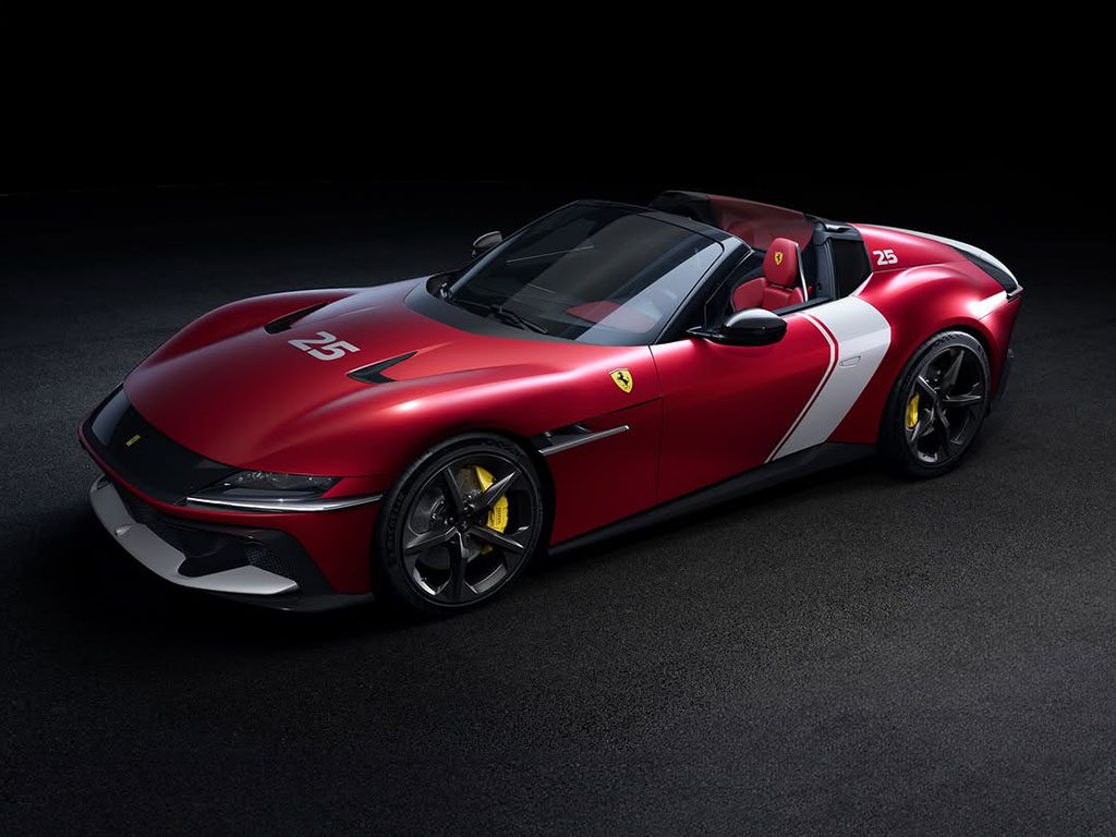 A striking Rosso Racing Ferrari with white accents, marked by the number 25 and vibrant yellow brake calipers, elegantly sits on a dark surface. The car channels the power of a 12Cilindri Spider, exuding pure automotive excellence.