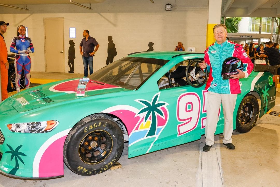 Frank Voytek standing in front of a race car
