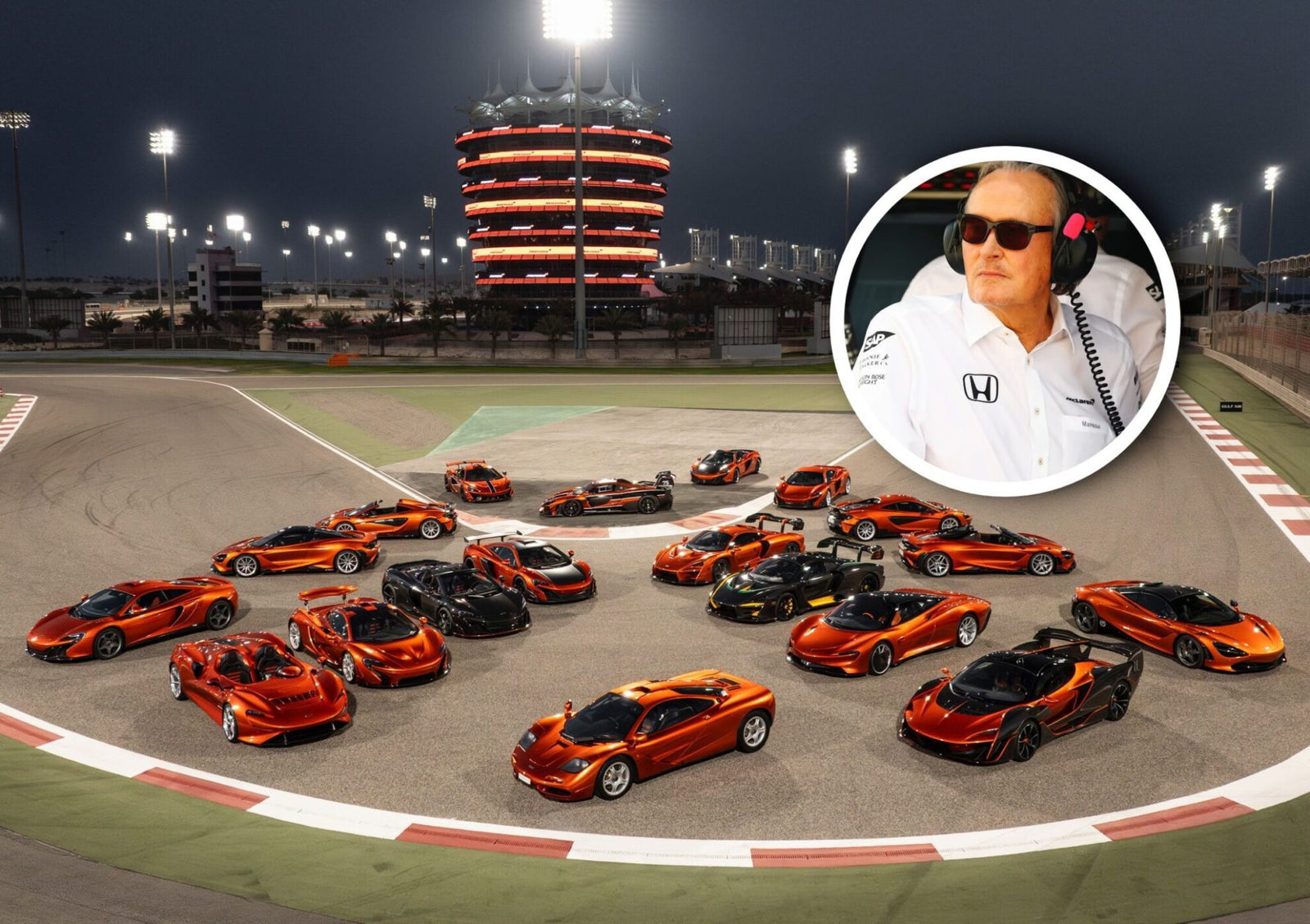 A group of orange McLaren Road Car Collection sports cars is parked on a racetrack at night; an inset photo shows Mansour Ojjeh in sunglasses and a headset with a Honda logo.