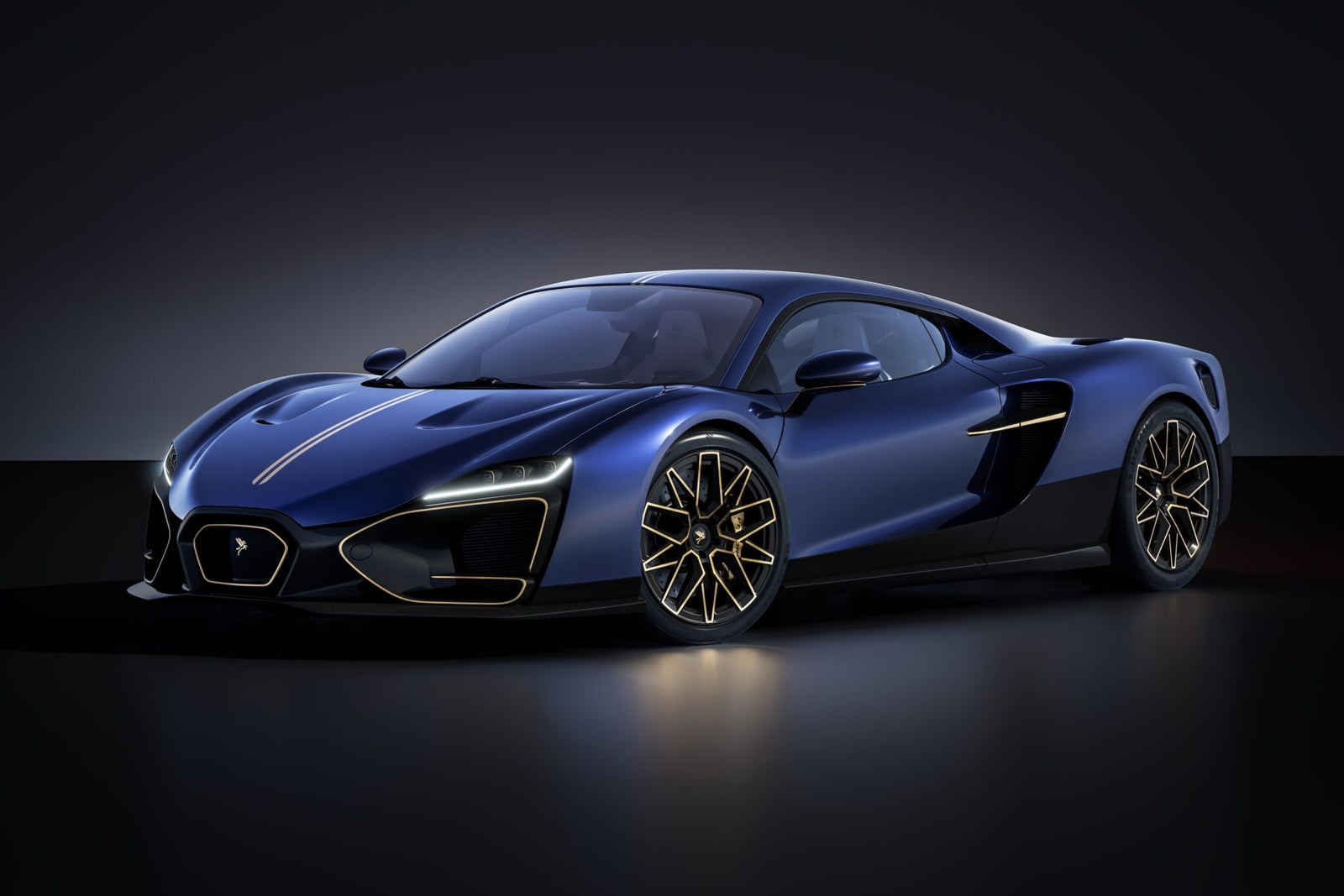 A sleek blue sports car with gold accents, low profile, aerodynamic curves, and large alloy wheels, inspired by Vittori’s new hybrid hypercar with Pininfarina design, is shown in a dimly lit studio setting.