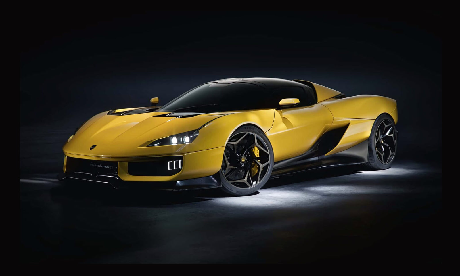 A yellow sports car with black accents, photographed in a dark studio setting with accent lighting highlighting its sleek design—Italy’s Latest V12 Supercar redefines luxury and performance.