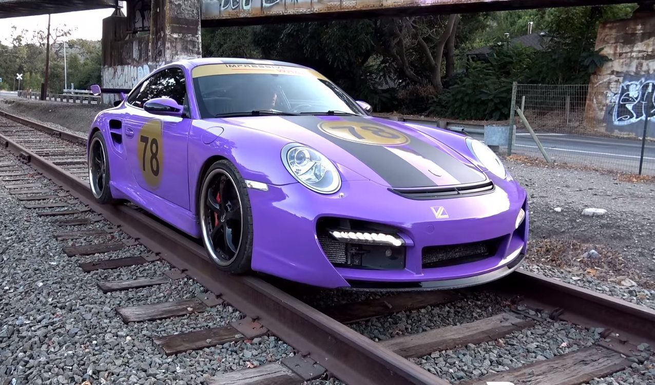 purple-porsche-911-train-tracks