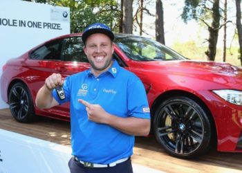 VIRGINIA WATER, ENGLAND - MAY 21:  Andrew Johnston of England poses with the keys to his new BMW M4 Coupe after his hole-in-one on the 10th hole during day 1 of the BMW PGA Championship at Wentworth on May 21, 2015 in Virginia Water, England.  (Photo by Andrew Redington/Getty Images)