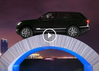 Range Rover Drives Over Paper Bridge
