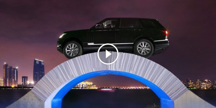 Range Rover Drives Over Paper Bridge
