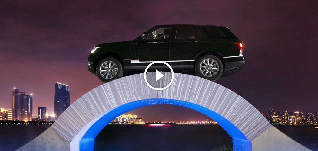 Range Rover Drives Over Paper Bridge