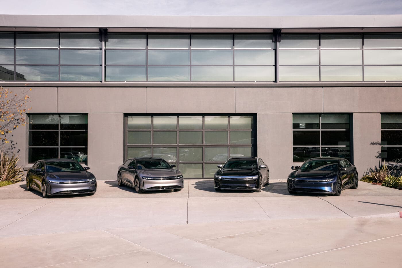 An image of four Lucid Air Sedans parked outdoors.