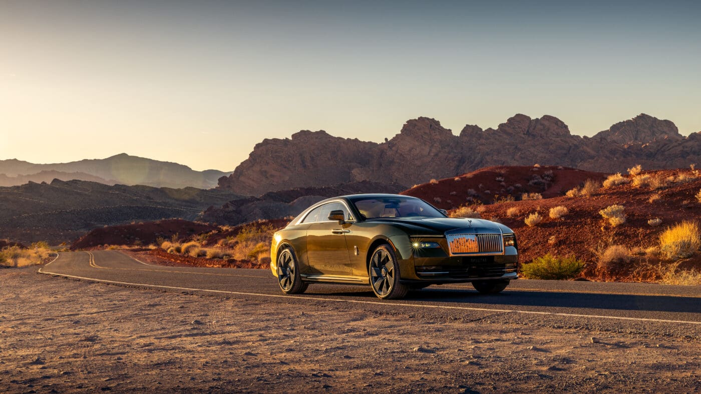 An image of a Rolls-Royce Spectre out in the desert.