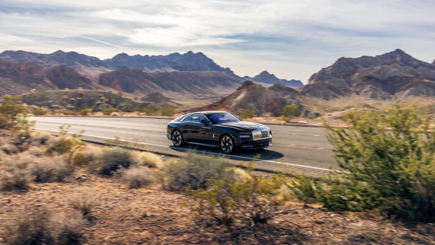 An image of a Rolls-Royce Spectre out in the desert.