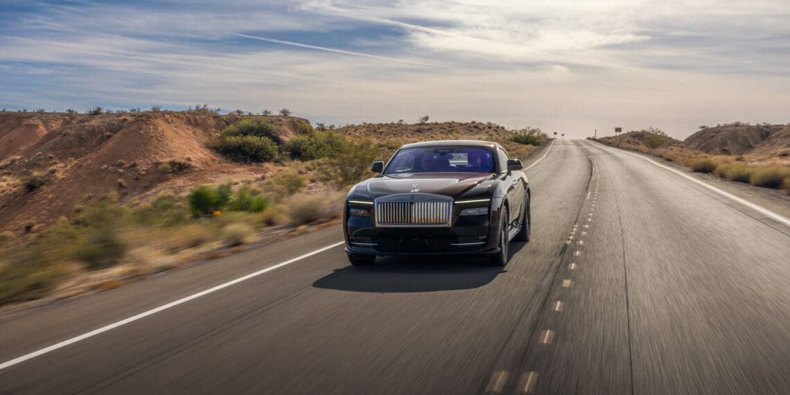 A Rolls-Royce Spectre on an open road.