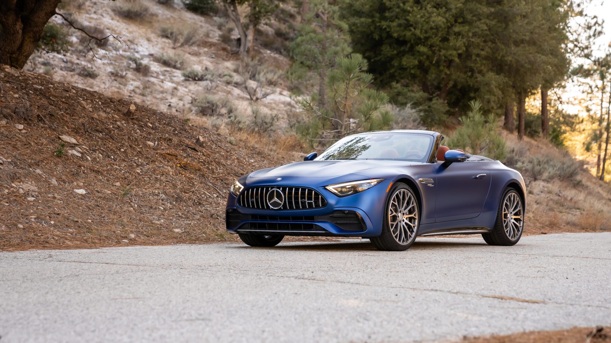 An image of a blue Mercedes-AMG SL 43 parked outdoors.