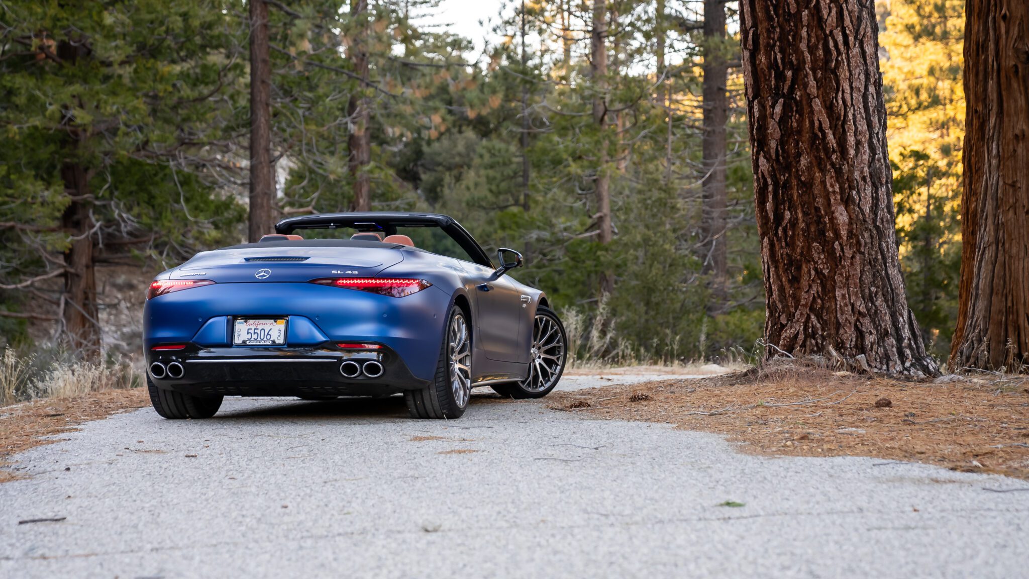 An image of a blue Mercedes-AMG SL 43 parked outdoors.