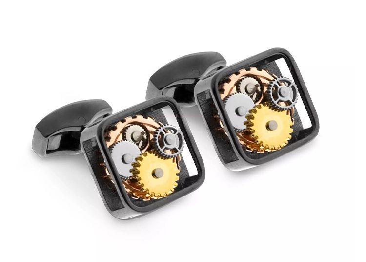 Square cufflinks featuring exposed gears in gold and silver tones, set in a sleek black frame. Highlighted in the 2024 duPont REGISTRY for their refined design, these cufflinks make an exceptional addition to any Valentine's Day Gift Guide, perfect for the style-conscious.