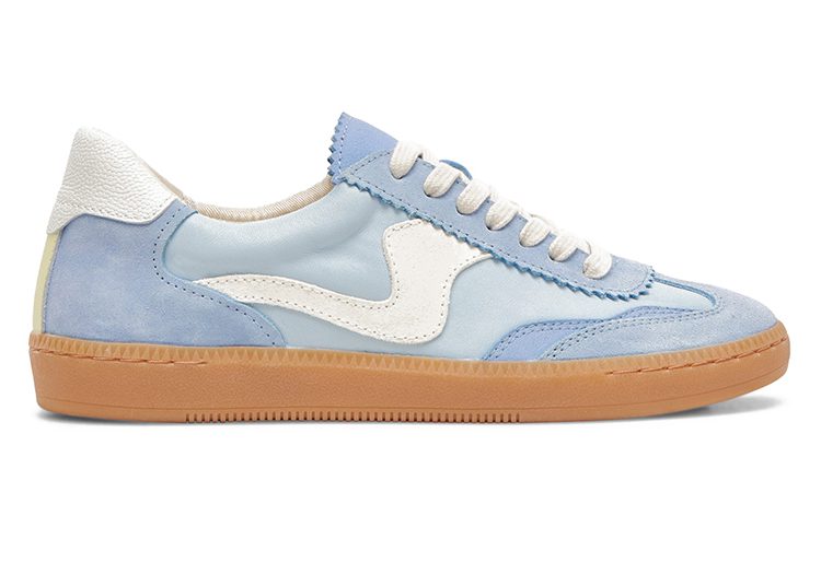 A light blue sneaker with white and beige accents, white laces, and a brown rubber sole—an ideal pick for 2024's Valentine's Day Gift Guide.